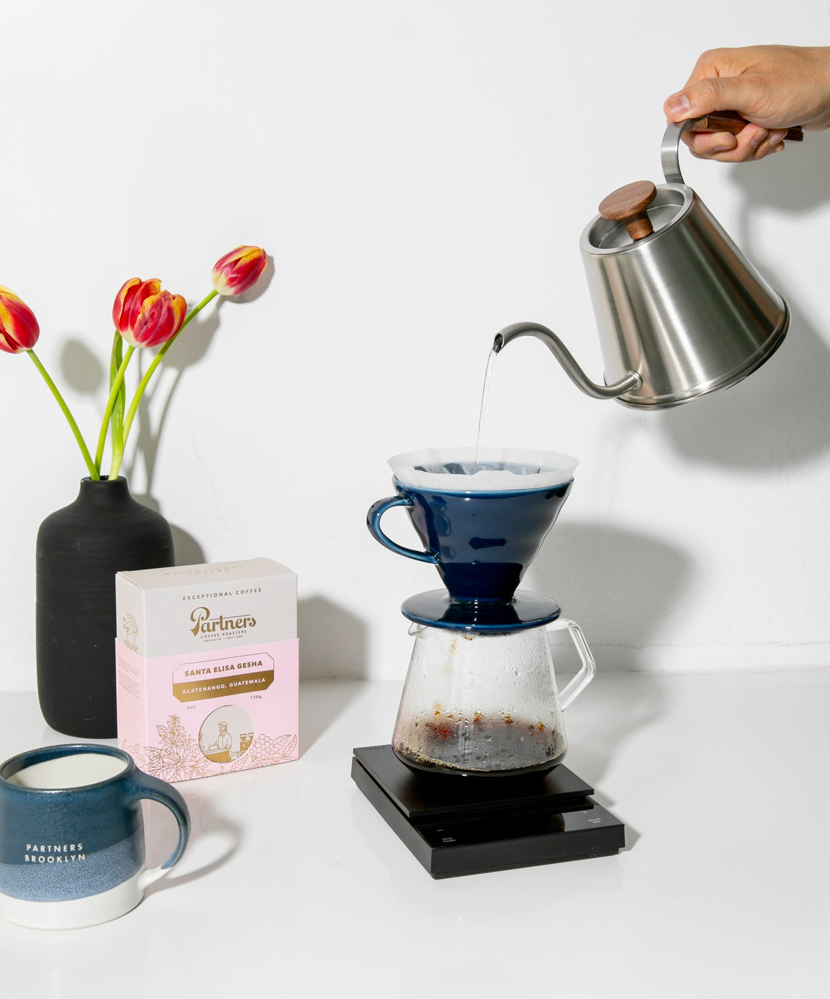 Partners Coffee Santa Elisa Gesha next to a brewing V60 pour over